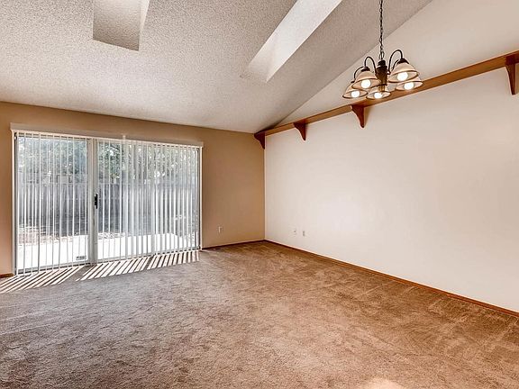 Tiled entry leads to great room. Vaulted ceiling and skylights.