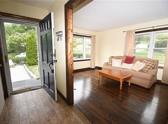 Welcome to this adorable cape cod home. Entry foyer is highlighted with tile flooring.