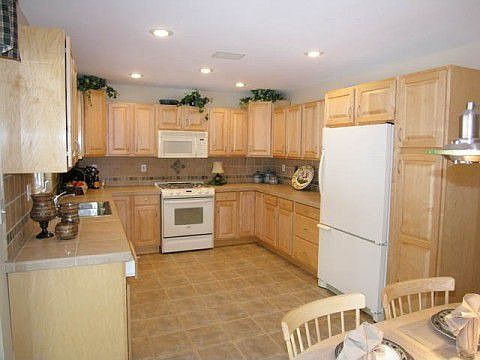Open kitchen with natural stone countertops