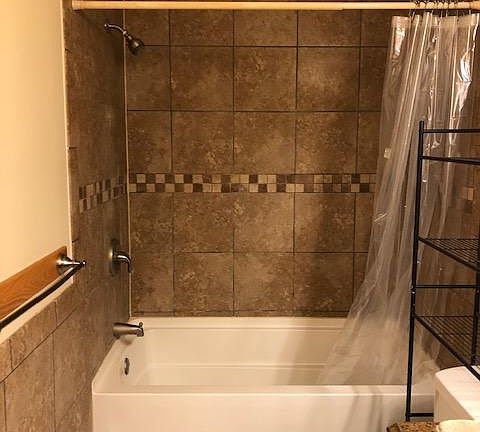 Newly tiled bathrooms make getting ready in the morning a little easier. :)