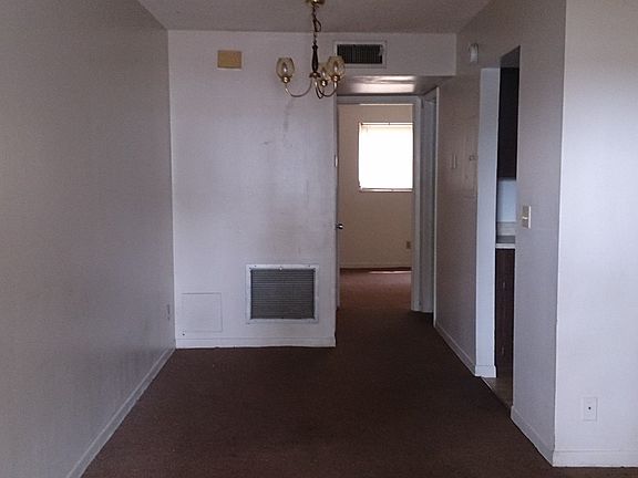 Living room open to separate dining area off of the galley k
