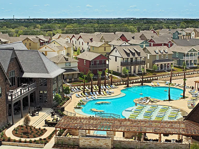 Explore this luxurious residential community, featuring a stunning pool area perfect for relaxation and leisure.