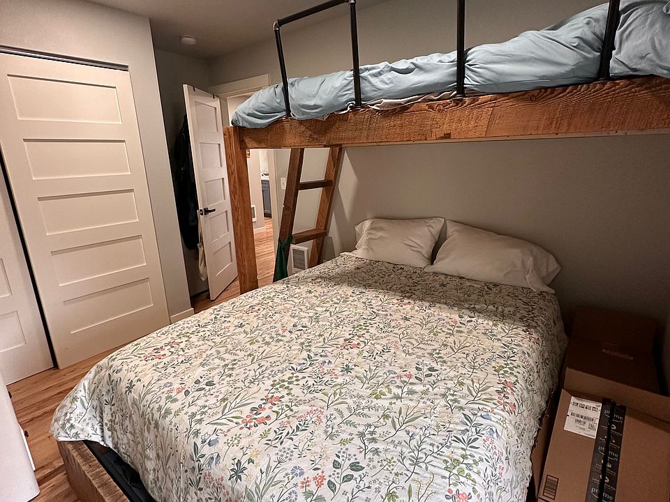 Bedroom with queen bed and twin bunk above