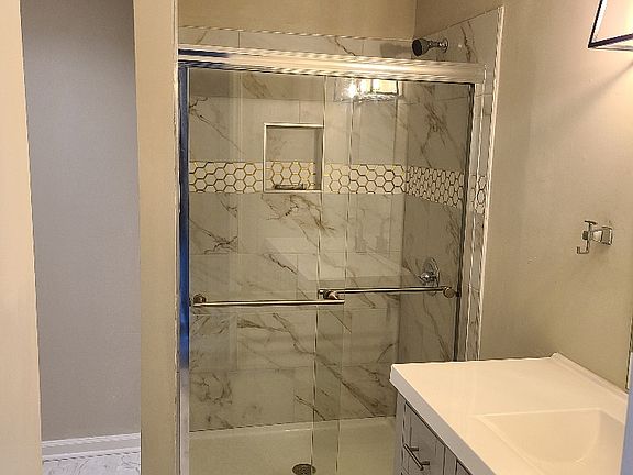 Tiled Shower (will be shower curtain on most units).
