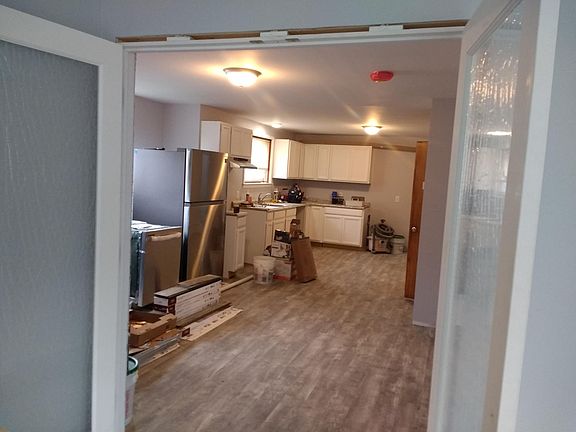 Standing in den looking into Kitchen Dining room. (See glass den doors open)