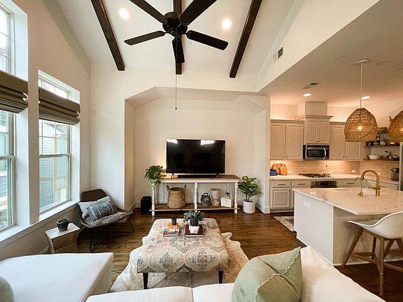 Open Concept Living Room with vaulted ceiling.