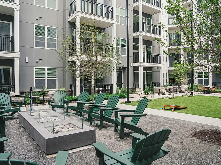 Multiple courtyards with lounge areas, grilling stations and lawn games.