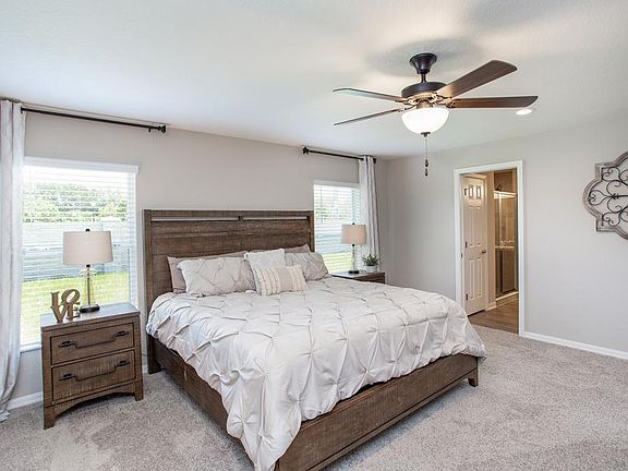 Spacious owner s suite with elegant tray ceiling and roomy walk-in wardrobe - New home for sale in L
