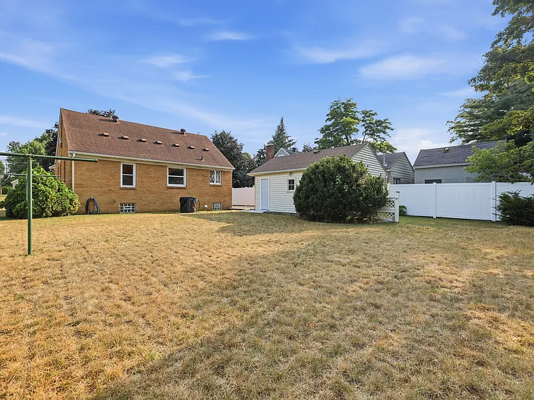 Large and very private backyard, fenced in on one side and evergreens lining the other two.