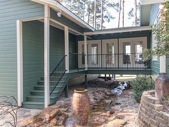 The dry river bed runs under the walk way that leads to the master suite. It is just stunning with the fountain flowing. This walk way has views of the as well as the backyard. The house has recently been painted and looks fresh and new.