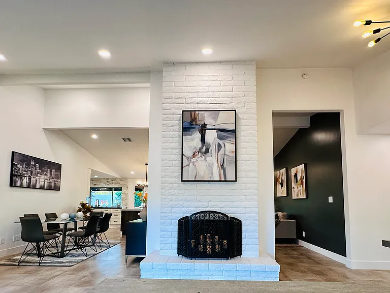 Two-Way Fireplace: 
A striking architectural feature that anchors the living spaces and adds a warm ambiance.