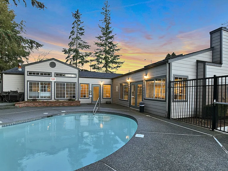 Novela Apartment Homes Pool Area and Clubhouse at Dusk