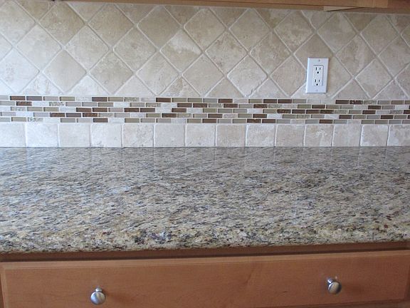 Kitchen - granite counter tops with decorative tile
