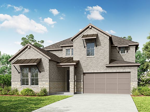 A two-story residential house with a garage, surrounded by lush greenery and a clear blue sky with f