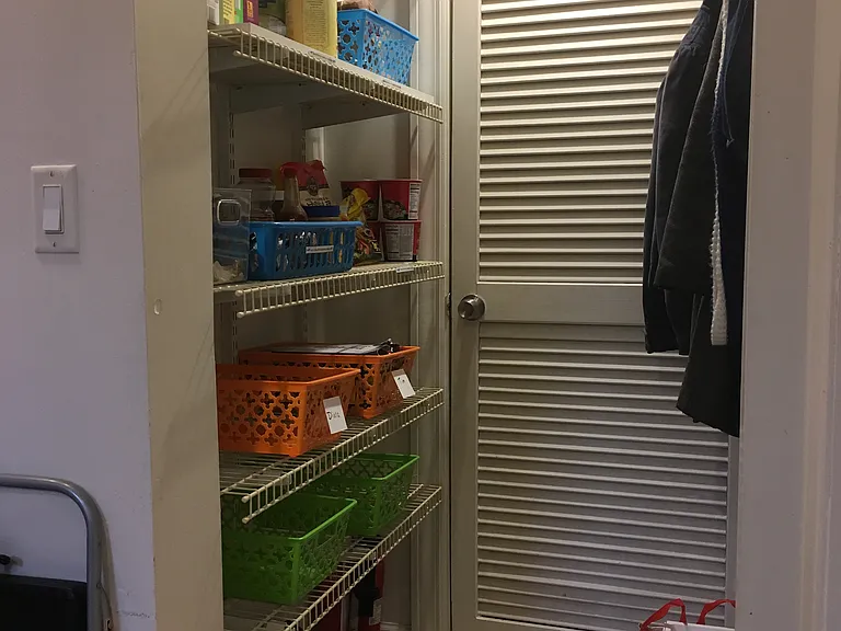 Pantry off the kitchen; HVAC behind the slatted door (heat and AC)