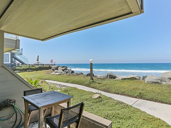 Beachfront view off the master bedroom before purple flowers bloom