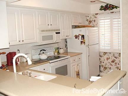 Major update in kitchen
						:
						Raised ceiling with new lighting, wood floor, & open to living/dining room