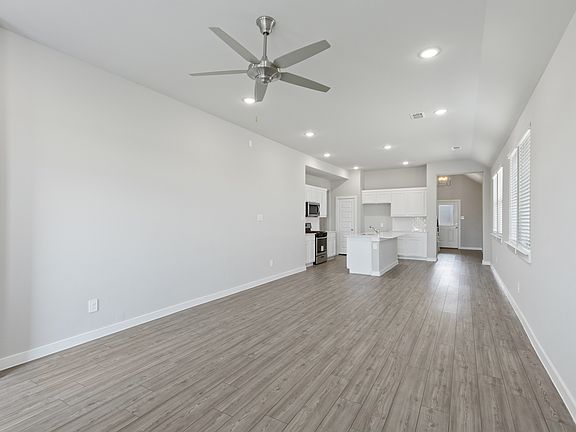 Open living space in the Elm home plan by Trophy Signature Homes - REPRESENTATIVE PHOTO