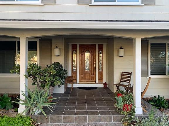 Front door with nice patio area.
