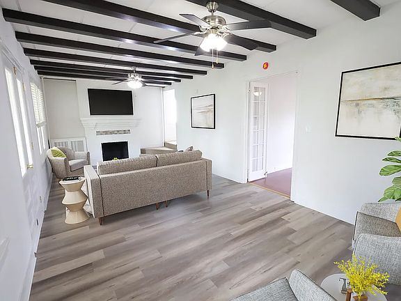 Living room space with exposed beams