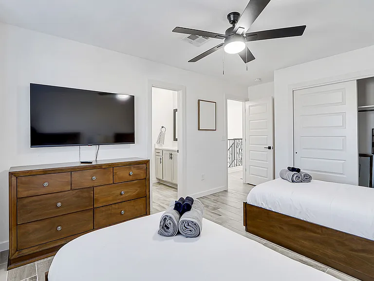 Bedroom with twin beds, Smart TV, closet and shared bathroom!