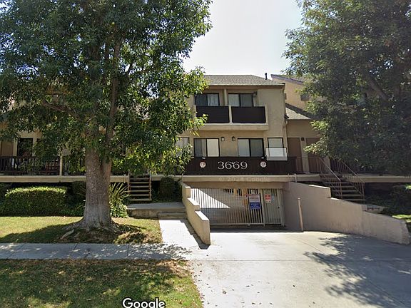 Beautiful building with townhouse style apartments and lower gated parking lot.