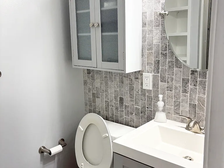 Private upstairs bathroom with storage and full tub/shower combo