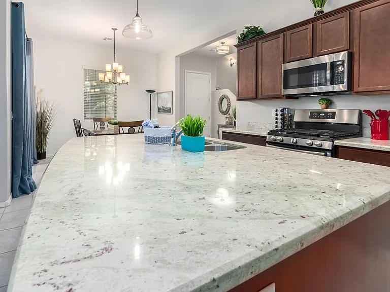 High end large granite island to gather around.
