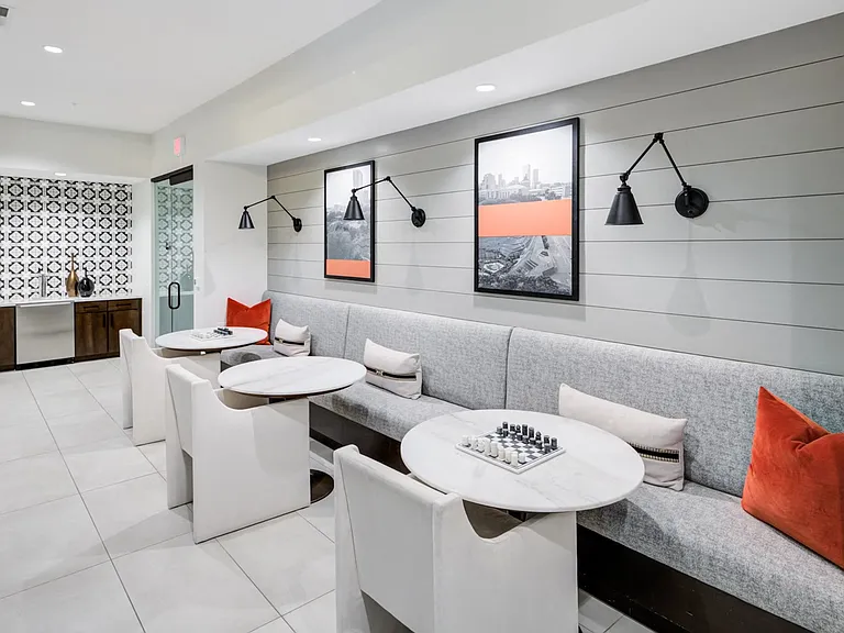 Casual Resident Lounge with Built-In Banquette and Chess Table