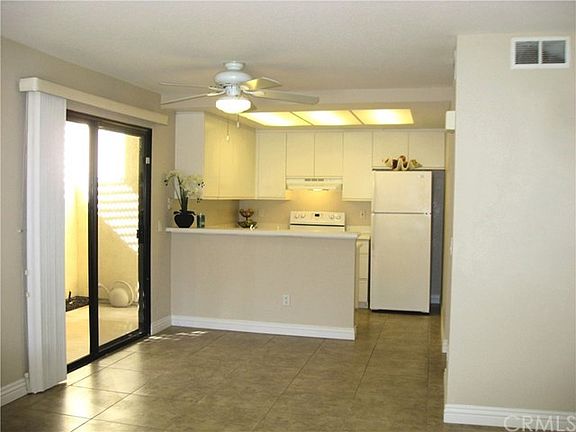 Private patio off dining area. Breakfast bar, and ceiling f