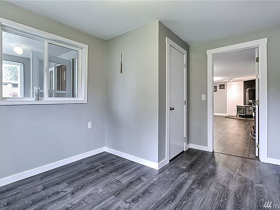 Looking into the main living space from one of the main floor bedroom/office 