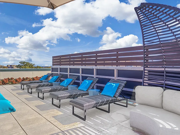 Rooftop sundeck with grilling stations and seating