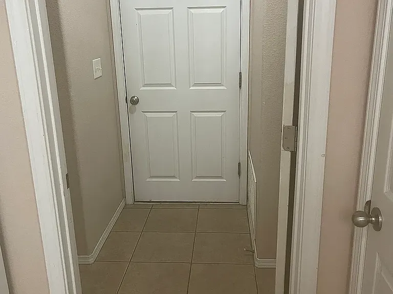 Entry to laundry room from kitchen. Door goes into garage