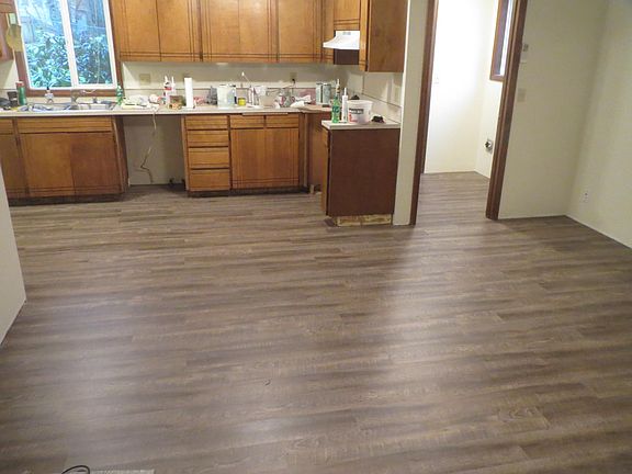  Kitchen and family room floors being installed. 