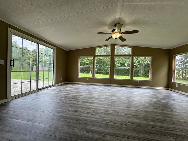 Enjoy backyard views from the sunroom, which opens directly into the dining room for a bright, open living space.