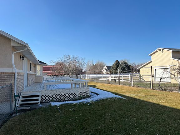 Gated back yard with fruit trees!