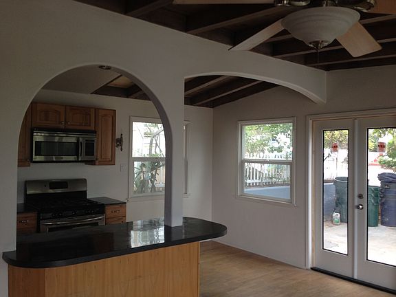 Kitchen from Living Room, view into Front Yard