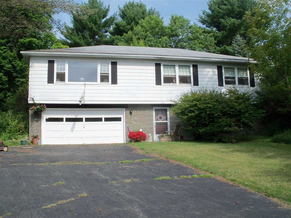 Not your ordinary ranch! Entrance is through the finished basement or the porch.