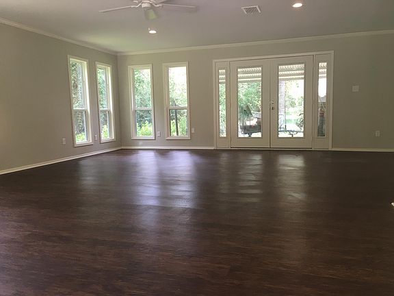 Living room opens to covered patio
