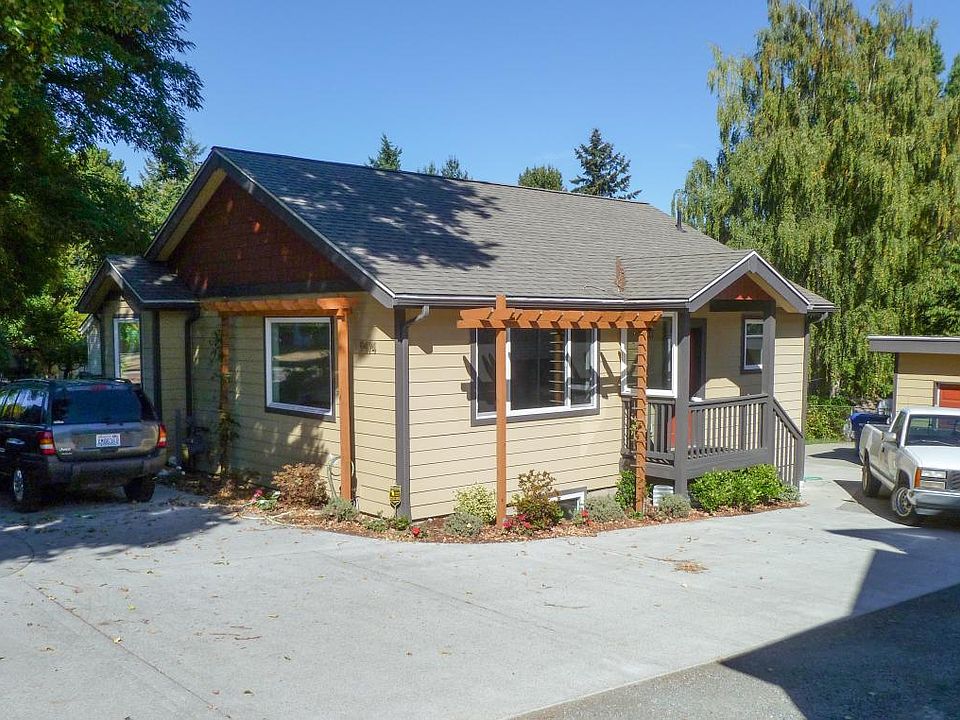 Driveway with parking at front and garage at end
