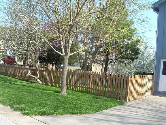 fenced shaded backyard