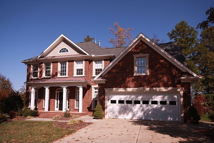 Brick veneer on front & low-maintenance vinyl siding on 3 sides