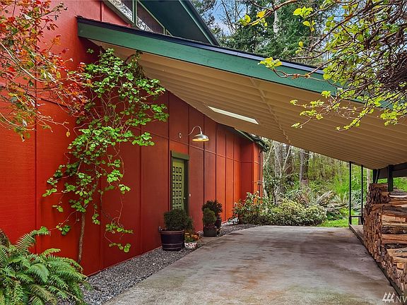 Plenty of covered parking; this generous carport, which also shelters your wood supply, and an attached one-car garage. Mature, easy-care landscaping.