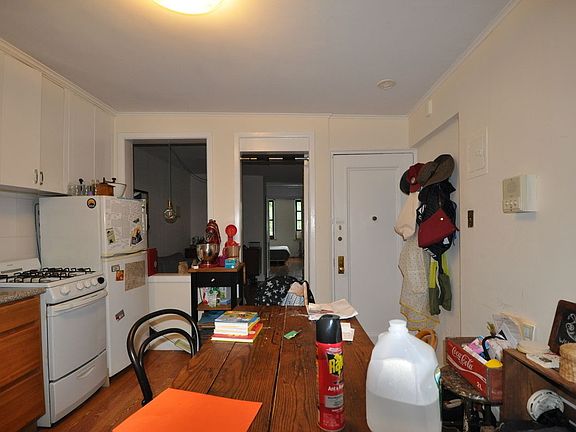 5th image of 303 E 10th St APT 4