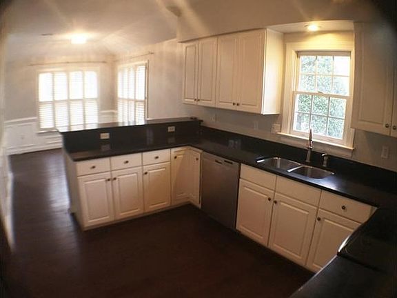 Kitchen w/ Hickory Hardwood Floors, Quartz Countertops, Stainless Appliances and sunny eat in area