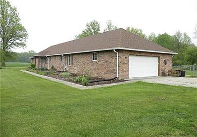 Rear of home has two wood decks with a hot tub. Fenced area for pets.