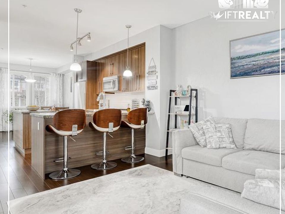 04_102-8251 209B St_Elegant Living Room_02202026