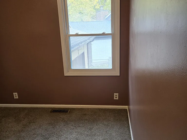 BR2 HAS CARPET, VIEW OF DRIVEWAY ON FIRST LEVEL