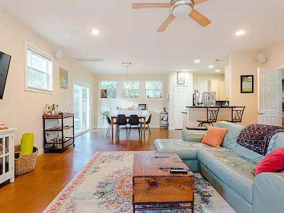 Lots of natural light from the well-lit living room. The windows adjacent to the dining area face east and make for nice sunrise lighting.