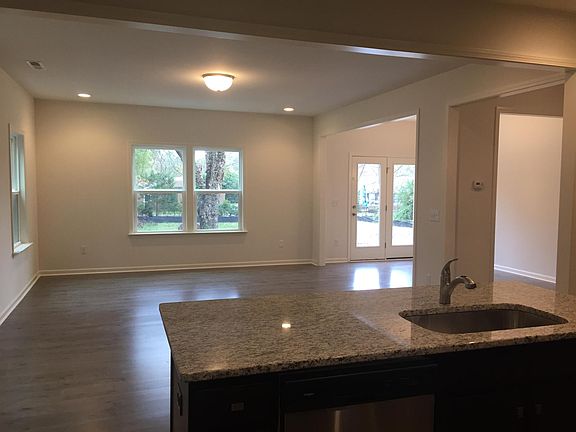 Kitchen island overlooking open living and dining room